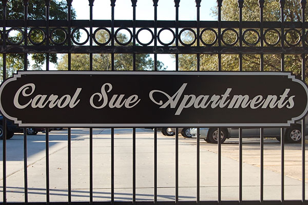 Carol Sue Gate with Apartment Logo
